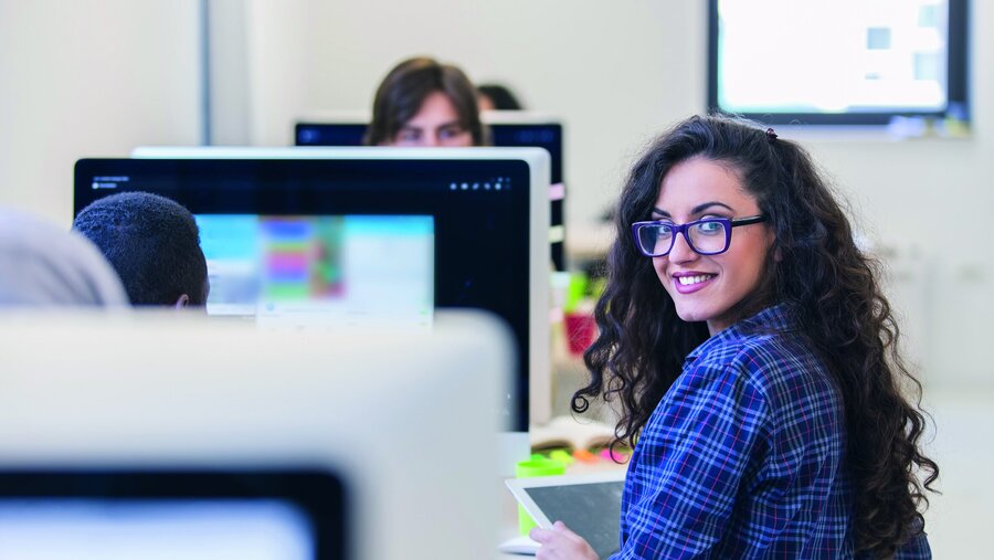 Group of entrepreneurs working using a computer