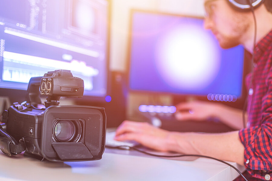 Professional cutting room for video editing and video producing: Monitors, camera and sound mixing