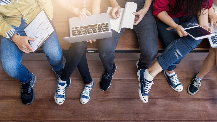 young people being used computer and tablet. education and technology concept